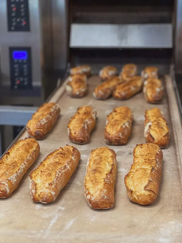 Fresh baguettes baking at Baker's Daughters