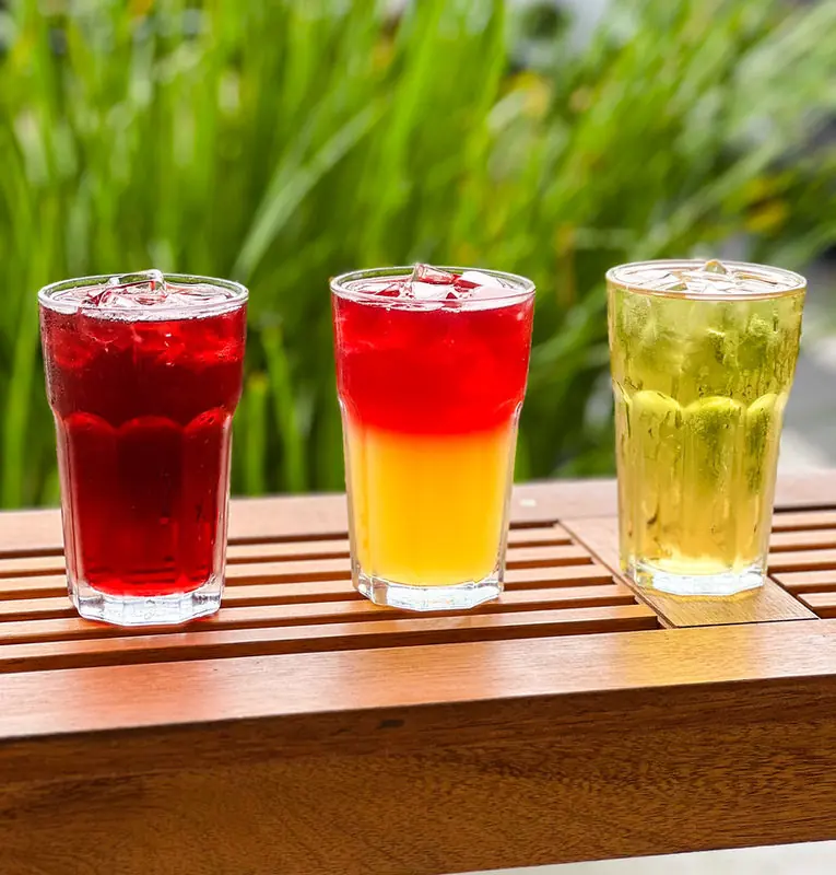 Colorful iced teas and limeade on the patio